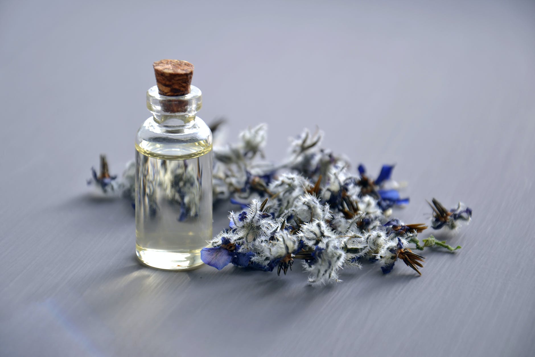 Aromatherapy Massage - selective focus photo of bottle with cork lid